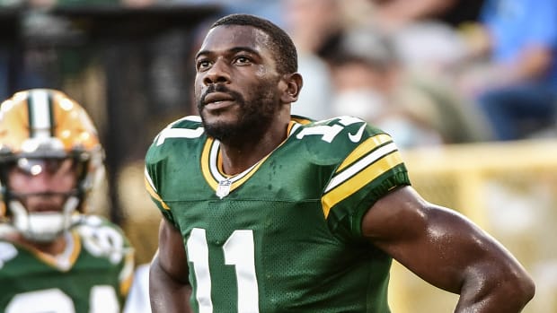 Packers wide receiver Devin Funchess (11) warms up before a game against the Texans at Lambeau Field.
